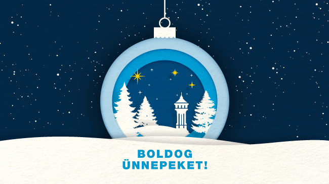 A grafikán egy karácsonyi díszgömb látható. A gömbön téli, esti környezetben hóval borított fenyők és a Fővárosi Vízművek jelképe, a víztorony kapott helyet. Felirat: Boldog ünnepeket!